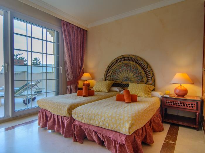 Master bedroom with sliding door to solarium
