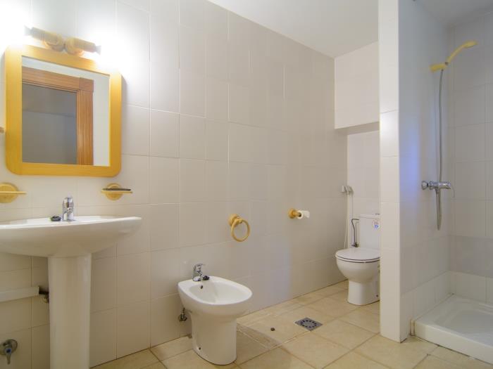 En suite bathroom with shower, toilet, sink