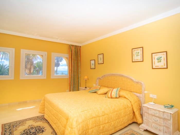 Master bedroom with large double bed and wardrobes