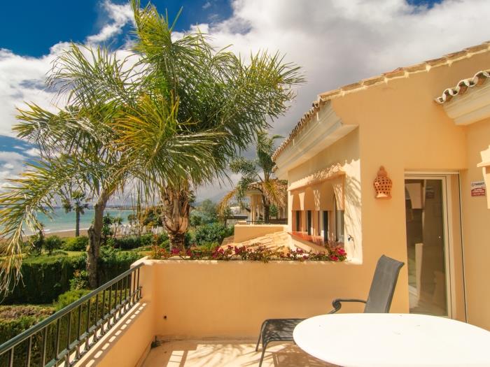 One of 3 terraces with sea views and dining area