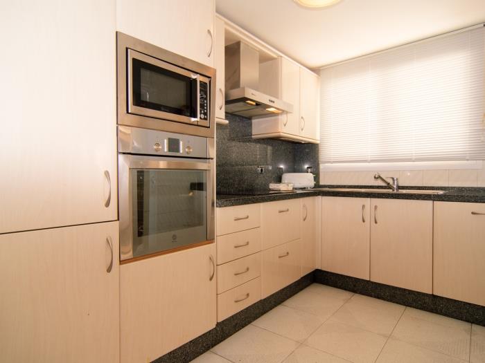 Kitchen next to the dining area of living room