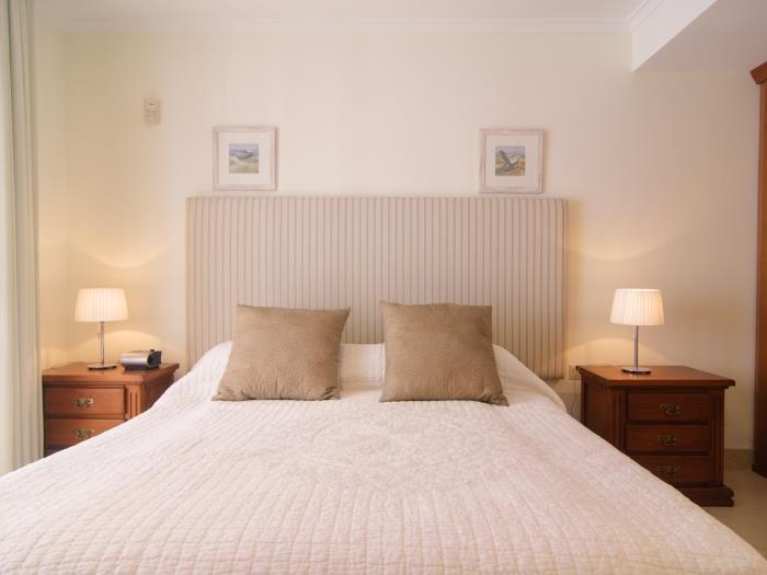 Double bed and nightstands with lamps