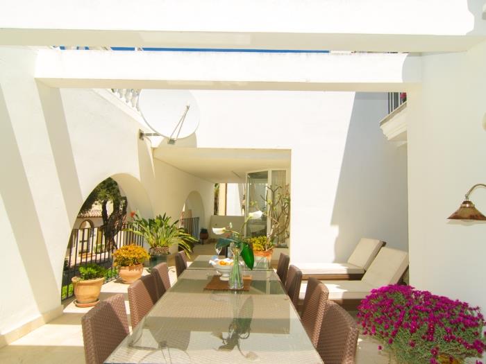 10 seater rattan dining table on large terrace
