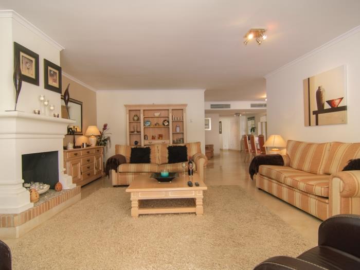 Very spacious living room with two large sofas