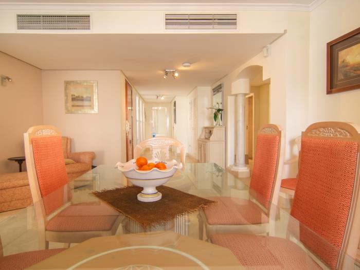 Glass table for six in dining area of living room