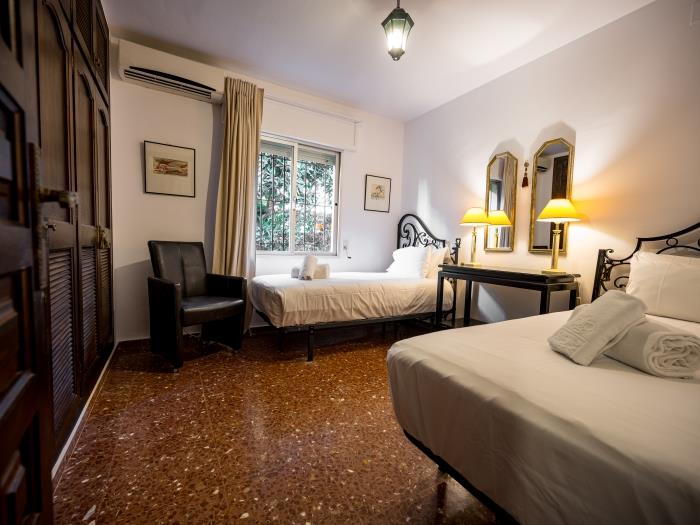 Two single beds and spacious wardrobes in bedroom