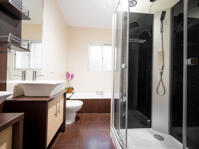 Bathroom with bathtub and jacuzzi shower