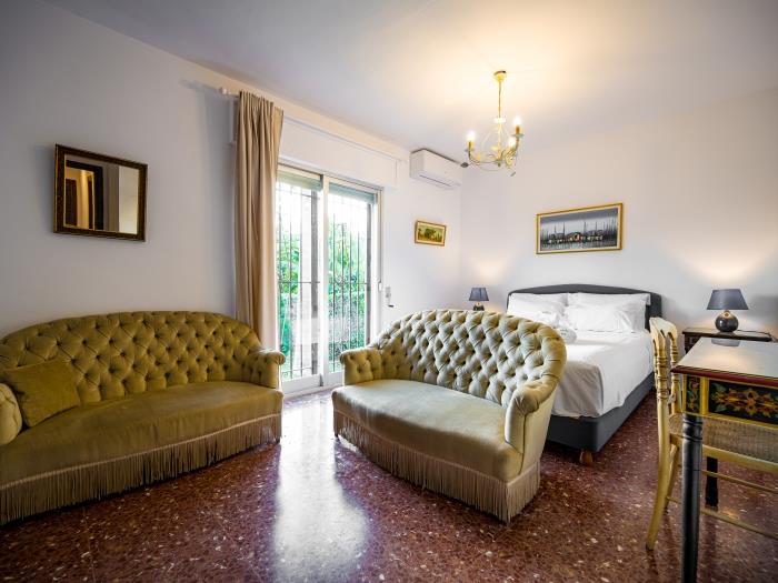 Double bed and large glass doors in bedroom