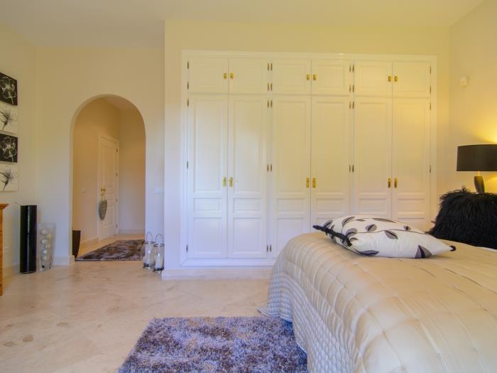 Bedroom with large wardrobes and double bed