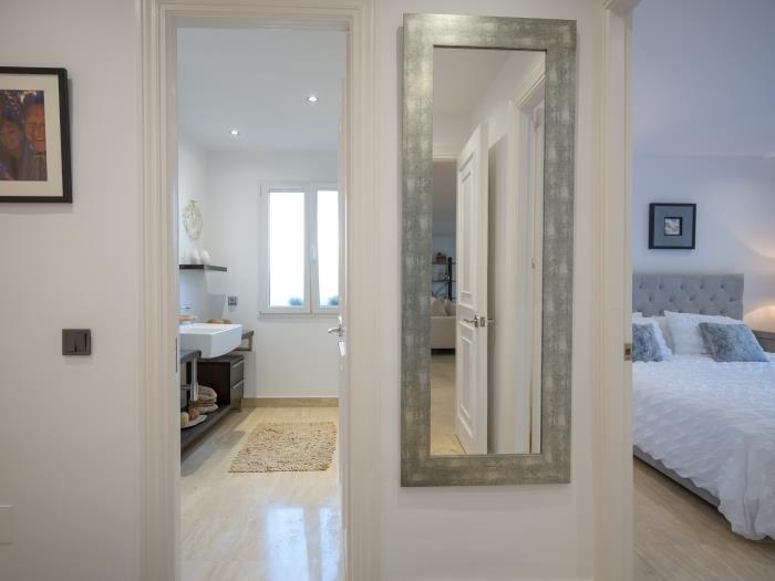 Double bed in guest bedroom with chest of drawers