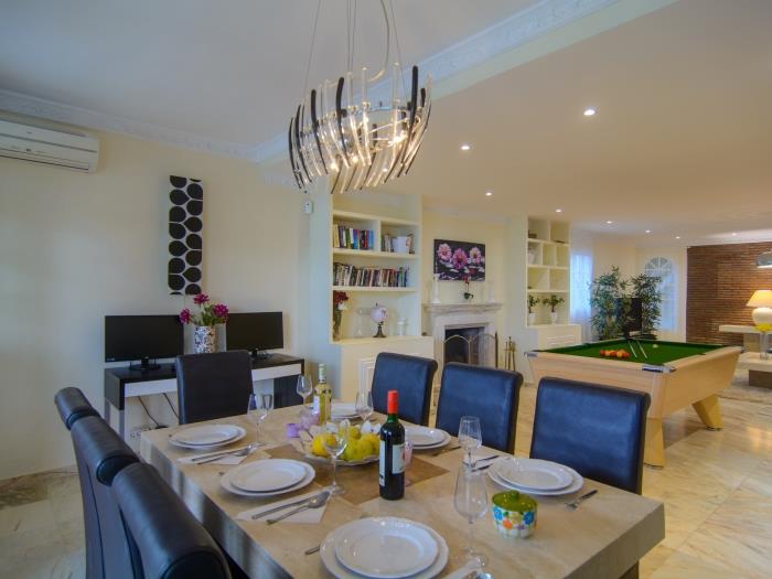 Living room with dining area and pool table
