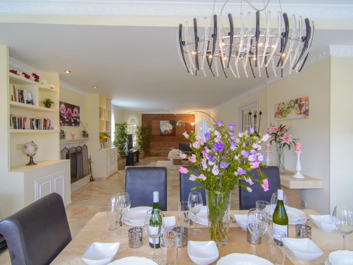 Spacious living room with elegant dining area