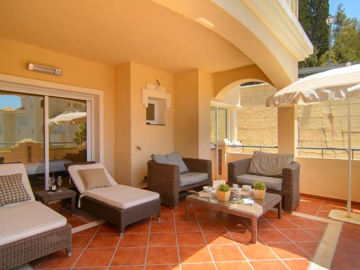 Spacious terrace with comfortable rattan loungers
