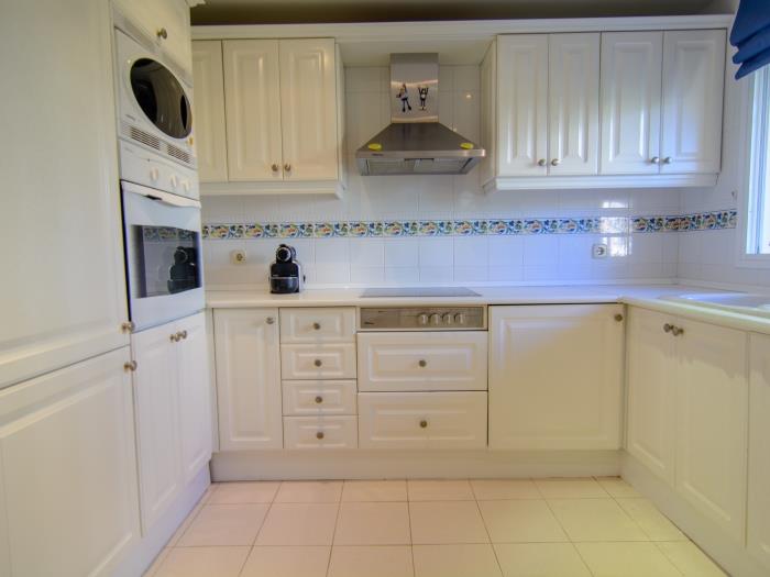 Kitchen with oven, microwave, fridge, espresso