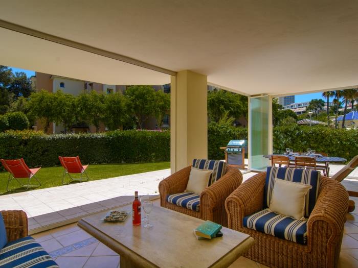 Spacious terrace with lounge area, rattan sofa