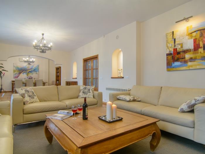 Comfortable sofas in lounge area with wooden table