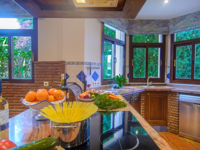 Plenty of light in homey kitchen, modern equipment