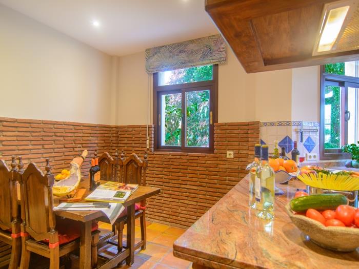 Small wooden dining table for four in kitchen