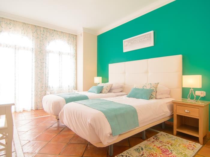 Guest bedroom with exit to terrace, makeup table