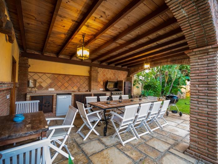 Spacious terrace with pool view and dining area