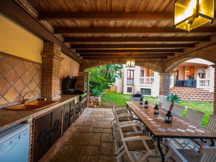 Homey patio, sink, cooking area, coffee machine