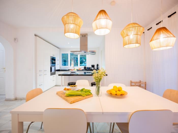 Open plan kitchen with island and bar stools