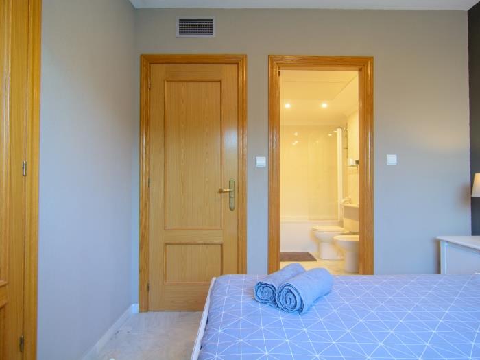 Master bedroom with double bed, en suite bathroom