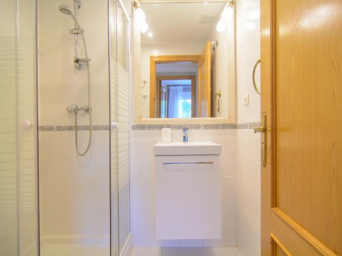 Family bathroom with walk in shower, sink, toilet