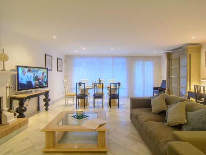 Spacious living room with sitting and dining area