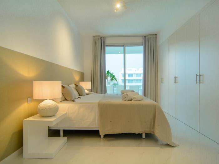 Double bed, large wardrobes and night lamps