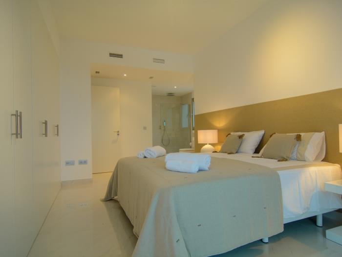 Master bedroom with open plan en suite bathroom