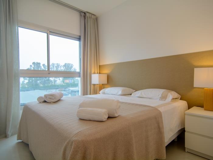 Guest bedroom with double bed and windows