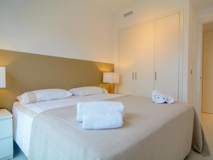 Double bed, nightstands, wardrobes and lamps