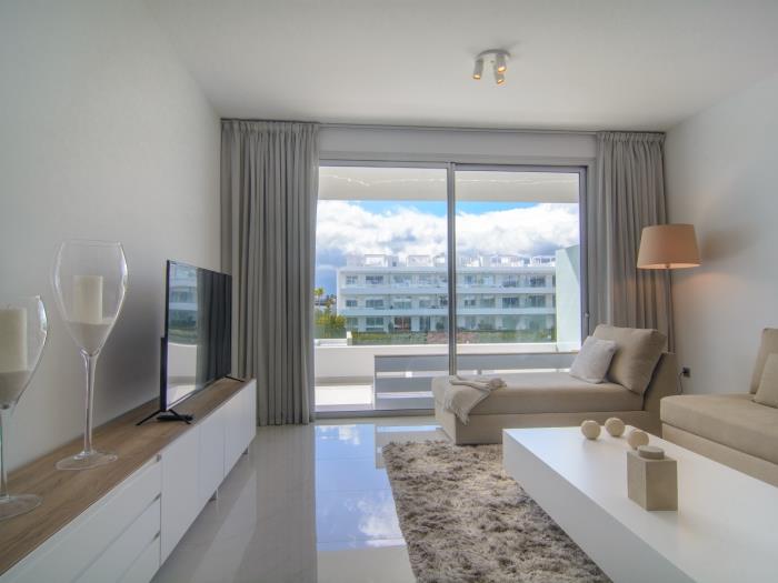 Flat screen TV in front of sitting area