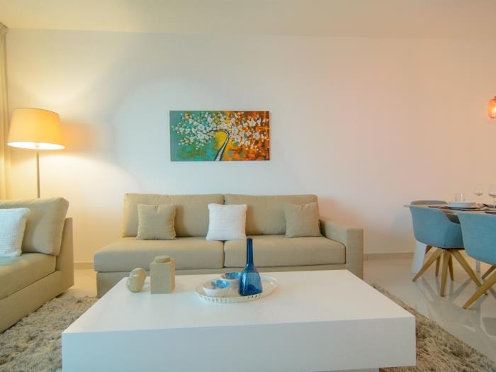 Sitting area with flat screen TV, exit to terrace