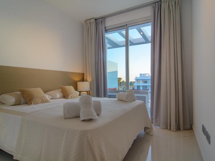 Double bed, large wardrobes and night lamps