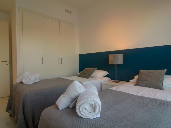 Guest bedroom with double bed and wardrobes