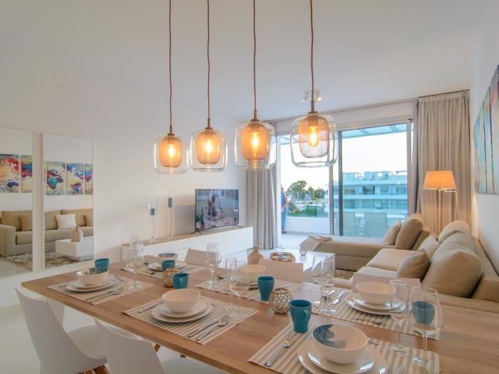 Dining area with 6 sitter table and armchairs
