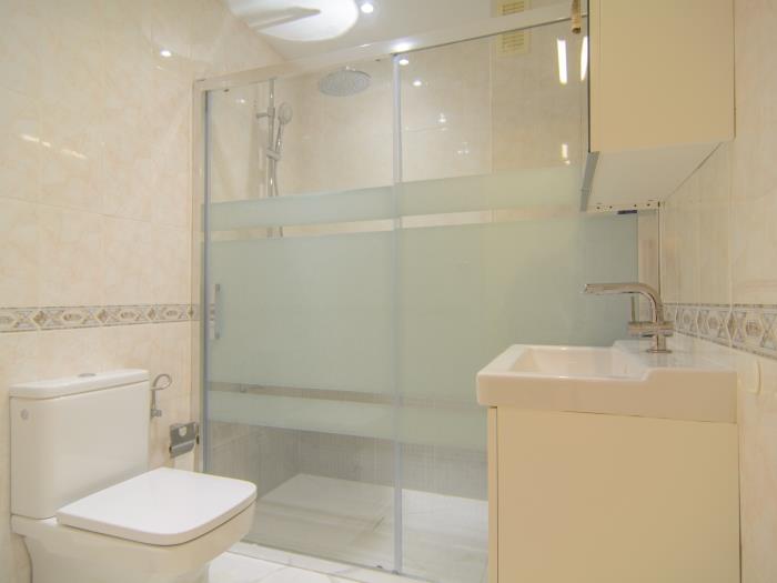 Family bathroom with walk in shower, sink, toilet
