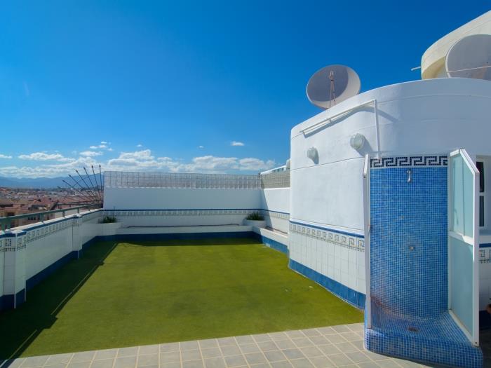 Rooftop pool area with shower and toilets