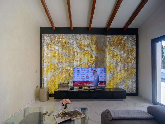 Living room with sitting area, TV, glass coffee table