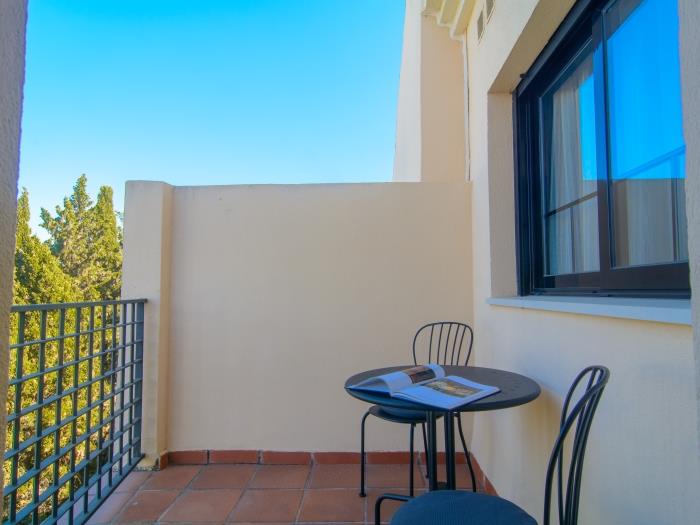 Small terrace with table and two chairs