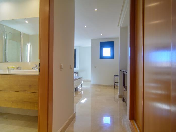 Bedroom with double bed, en suite bathroom and large wardrobes