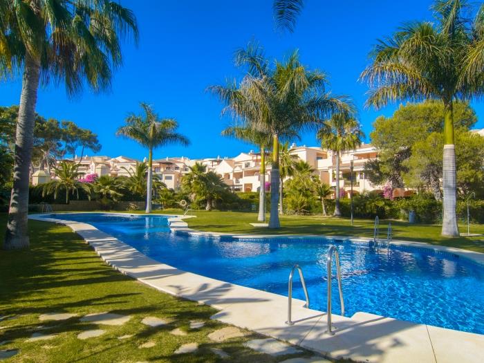 Las Mimosas urbanization with free shaped large pool, Mediterranean vegetation