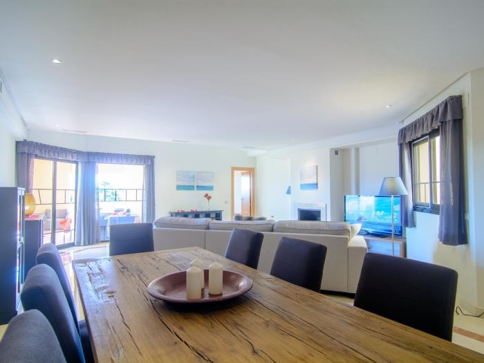 Wooden table for eight in dining area of the living room