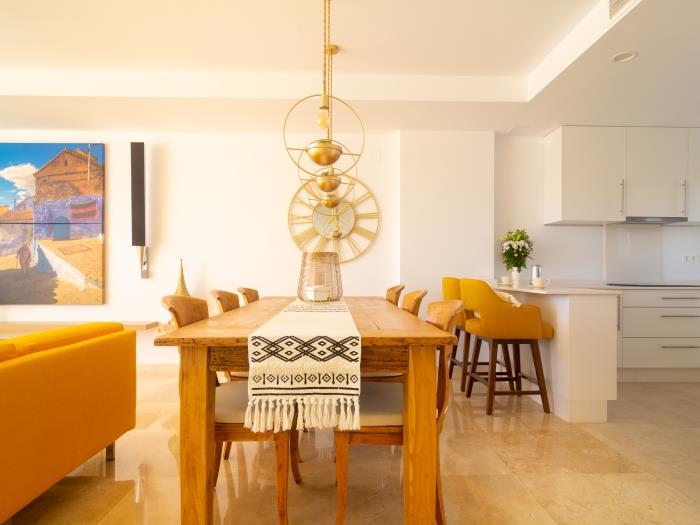 Open plan living/kitchen with handmade bespoke wooden table and chairs
