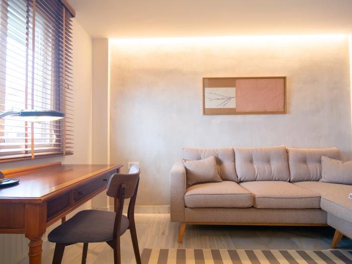 Comfortable sofa and work space in quiet welcoming room