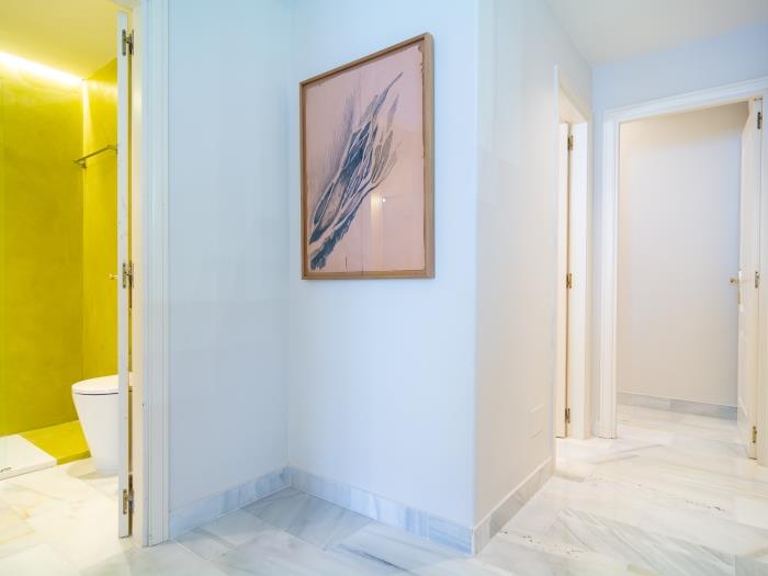 Hallway with artistic details and marble floors