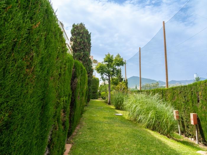 Beachside urbanization with beautiful mountain views and Mediterranean vegetation