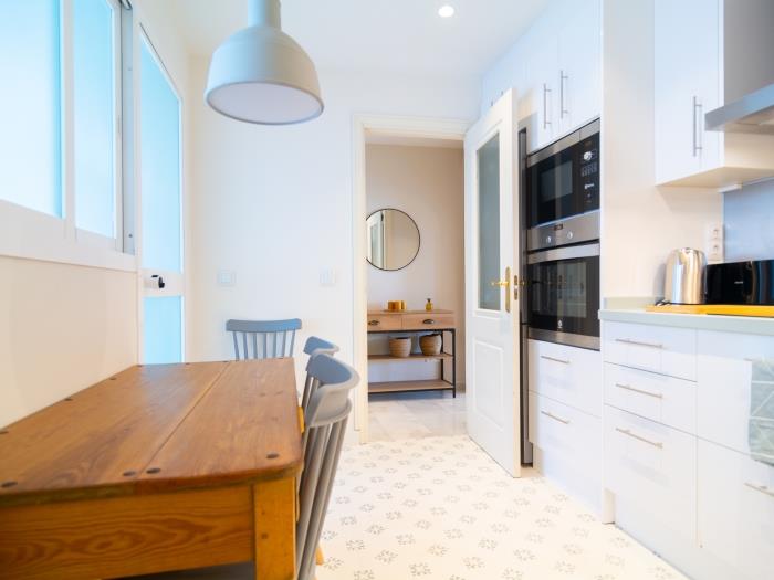 Kitchen with two utility rooms, light colors, neat design, all equipment needed